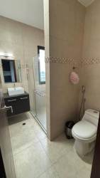 Compact laundry area with washer inside condo at Vista Mar San Carlos