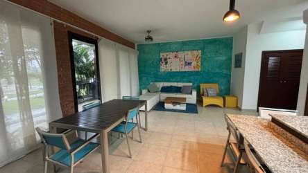 Furnished ocean view master bedroom with king bed and ensuite bath at Vista Mar condo