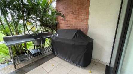 Modern kitchen with granite countertops open to living area in Vista Mar Resort San Carlos