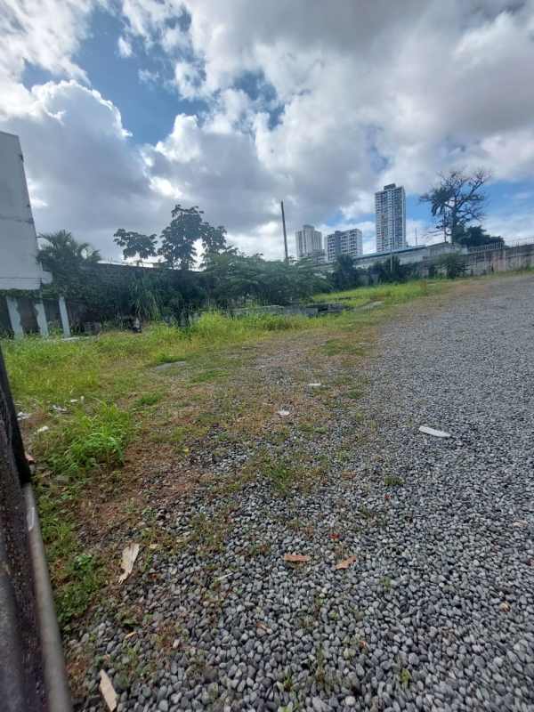 Open gravel lot with greenery at edges in urban zone Rio Abajo Panama