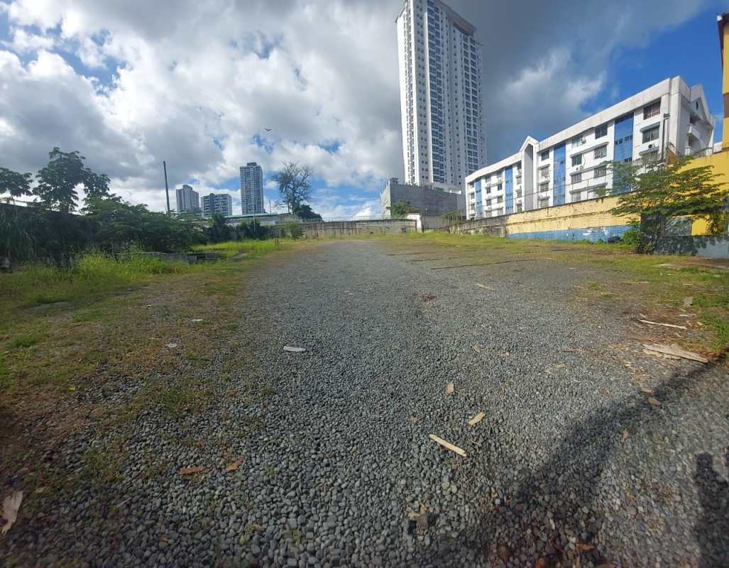 Vacant commercial lot surrounded by greenery and city buildings Panama