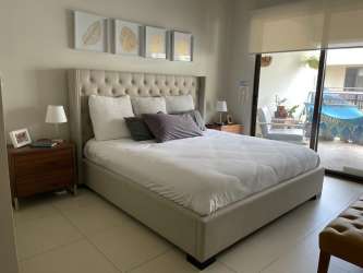 Contemporary dining area connected to living room in River Valley apartment Panama Pacifico