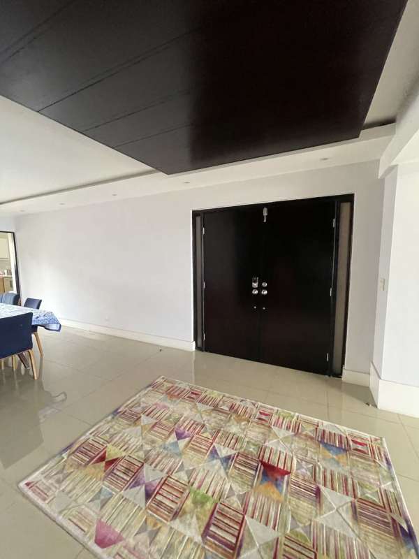 Elegant double-door entry and dining area in large Panama City apartment at PH San Francisco Bay