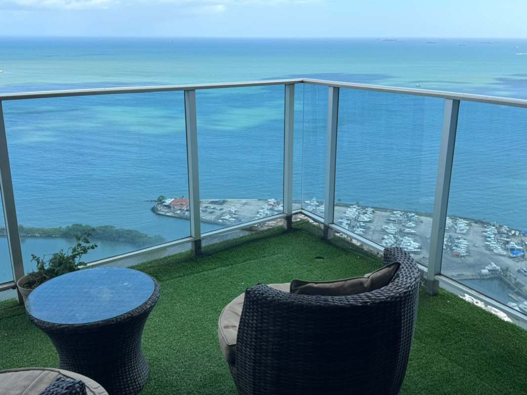 Master suite with ocean view window, walk-in closet, wood floors in PH White Tower Panama