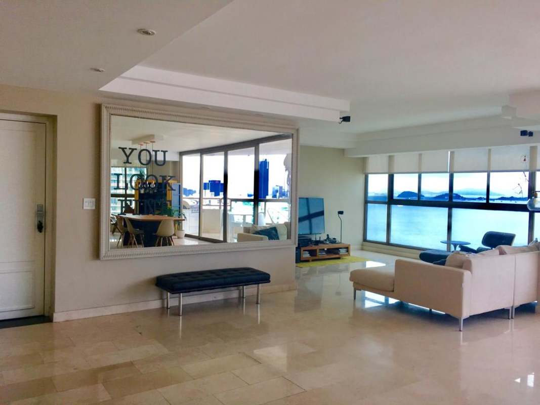 Marble floor living dining area with large windows and stunning views at PH Ocean Park Punta Pacifica