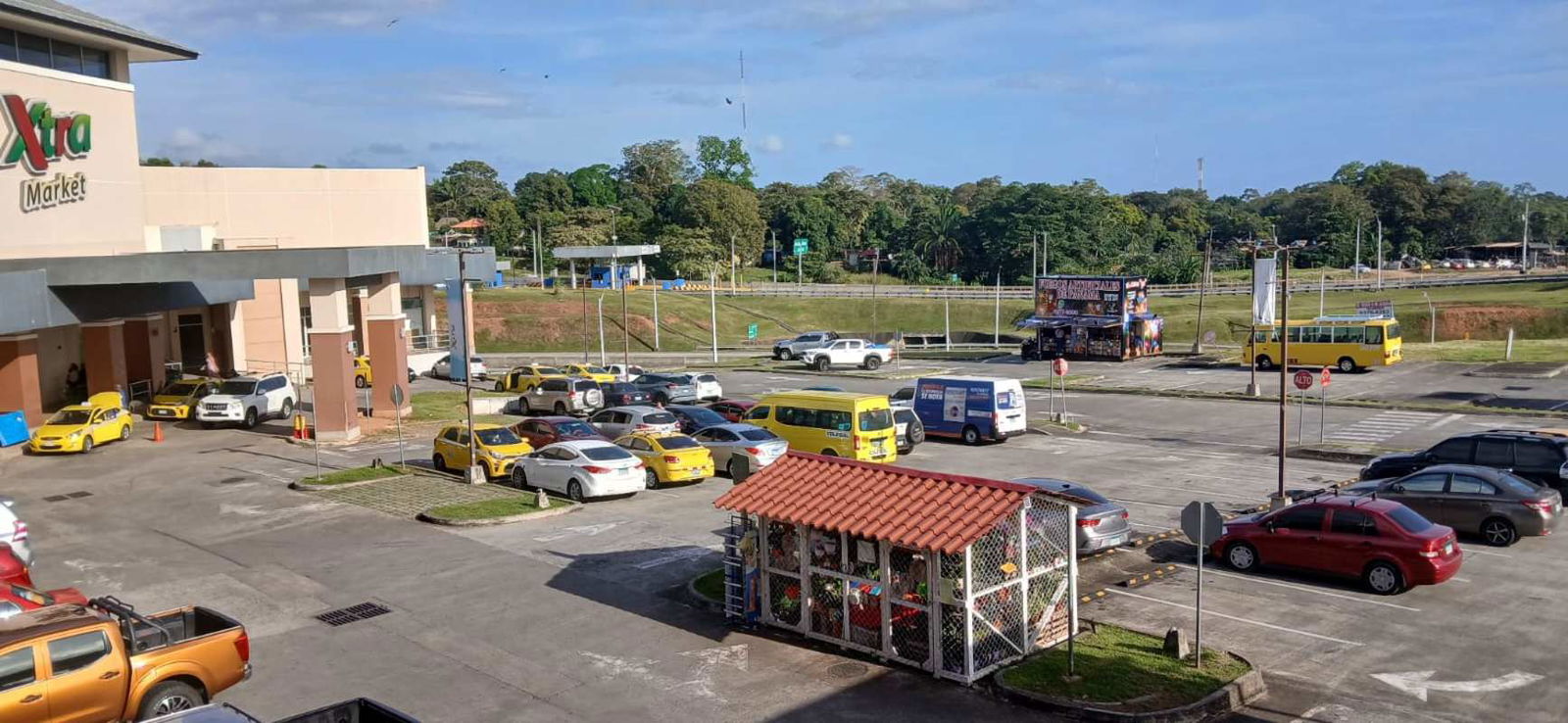 Covered exterior walkway with glass shop fronts Terranova Place Panama City