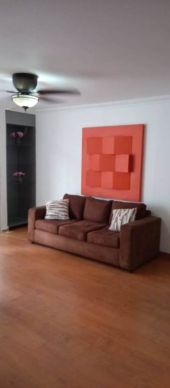 Modern living room with sofa wall art ceiling fan PH Argentina Tower Chanis Panama