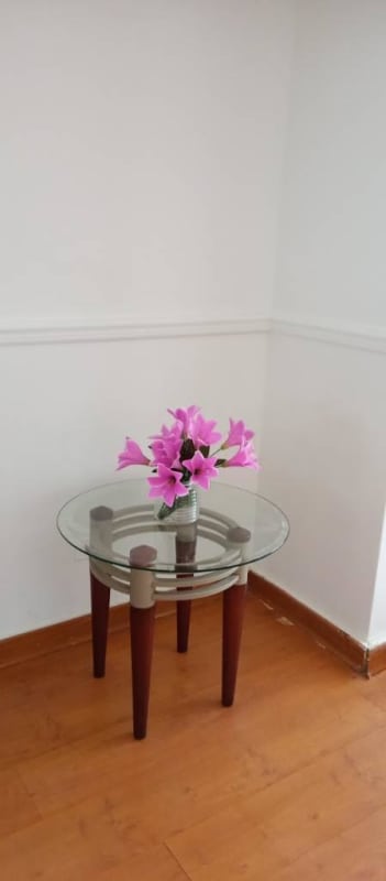 Entry hallway with glass side table and flowers PH Argentina Tower Chanis Panama