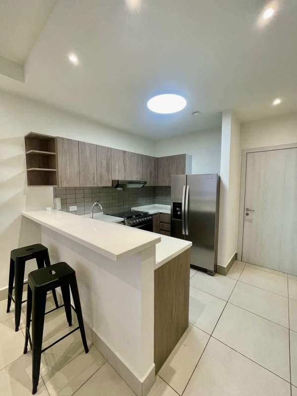 Sunny living room with balcony access and open dining PH Coco Place apartment for rent Coco del Mar Panama City