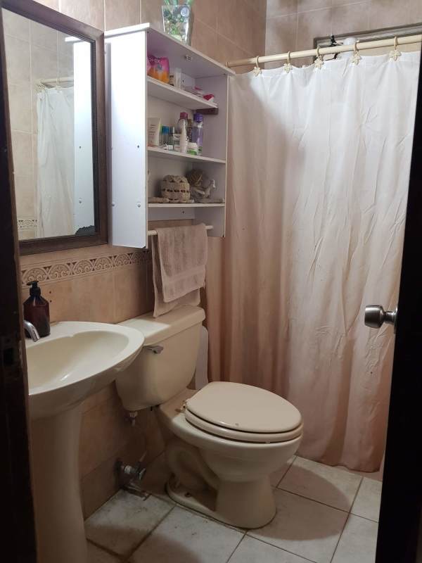 Tile bathroom with pedestal sink and full shower Betania Panama residential house