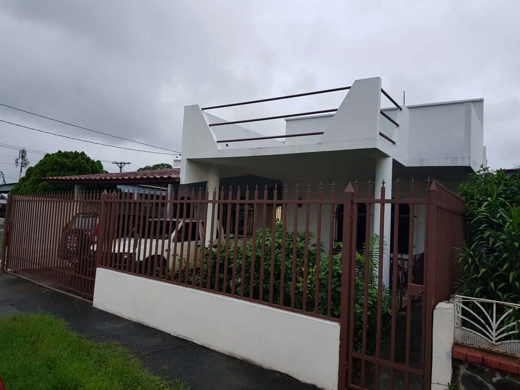 Gated entrance with covered parking suburban single family house Betania Panama