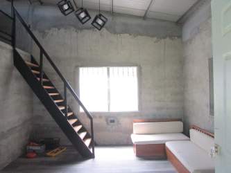 Lush green garden with banana trees back patio house for sale in Arraiján Panama