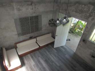 Living room minimalist design exposed concrete small house in Vista Alegre Panama