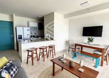Bright living area with large windows and ocean view at Playa Caracol beachfront condo Panama