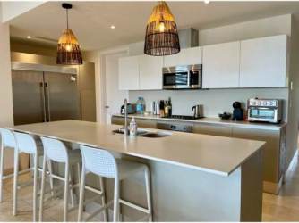 Bathroom with double sink vanity and glass enclosed shower in PH Marina Village Buenaventura Panama