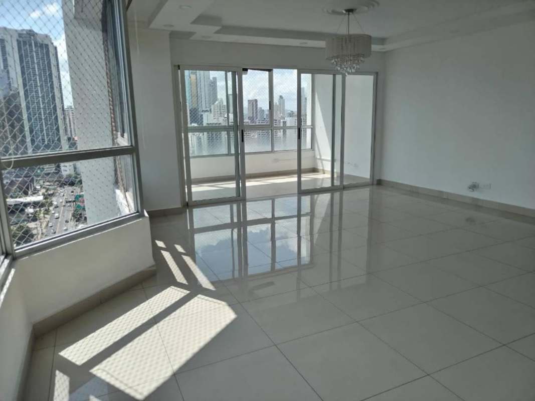 Modern condo lobby with elevators, polished floors, and lounge seating at The Palace Obarrio Panama City