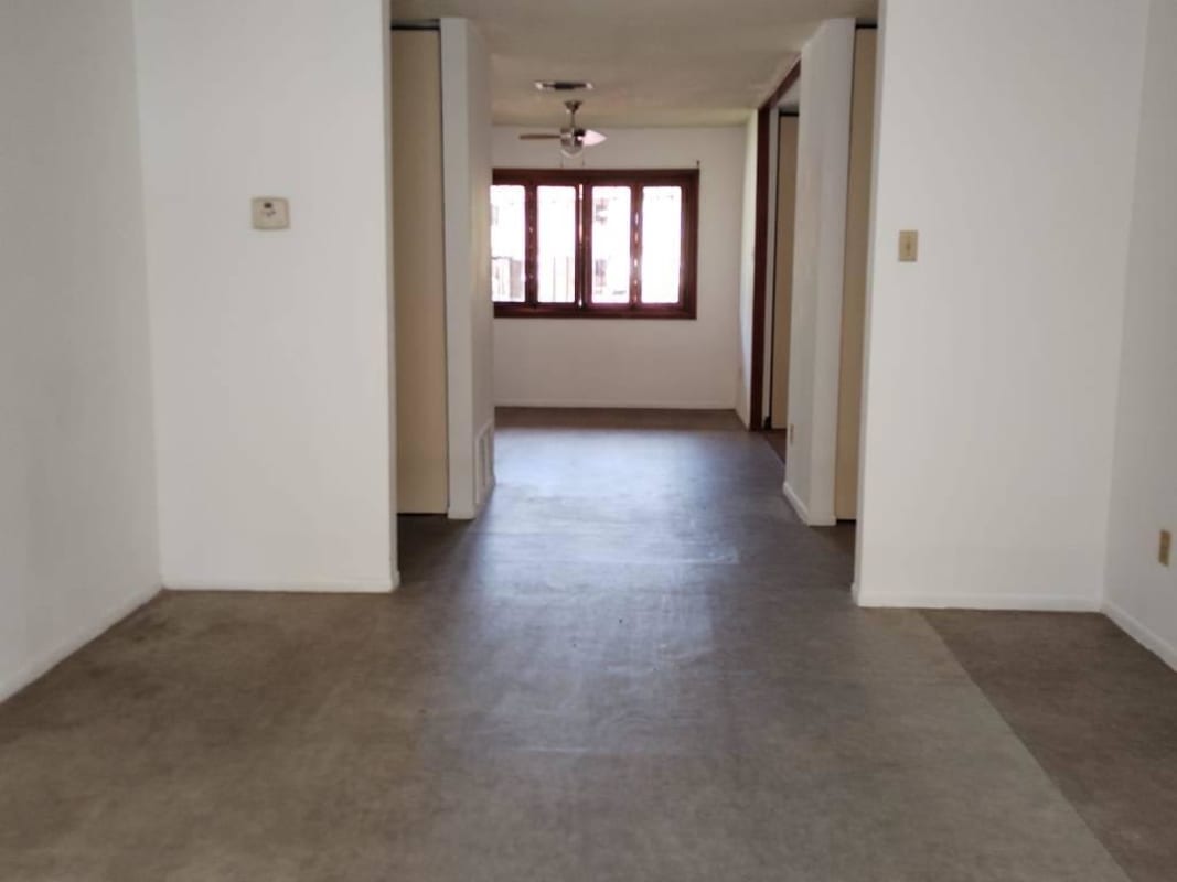 Ample traditional kitchen with wooden cabinets, gas stove, double sink, and window Clayton Park Panama