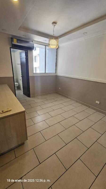 Modern bathroom with glass-enclosed shower, tiled walls, and vanity at PH Pacific Coast Panama