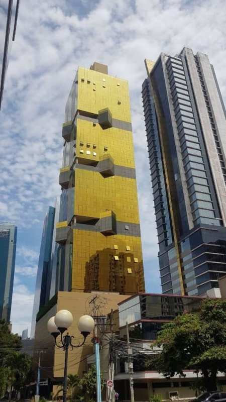 Tall modern golden glass skyscraper PH Downtown Obarrio with unique architecture in Panama City Panama