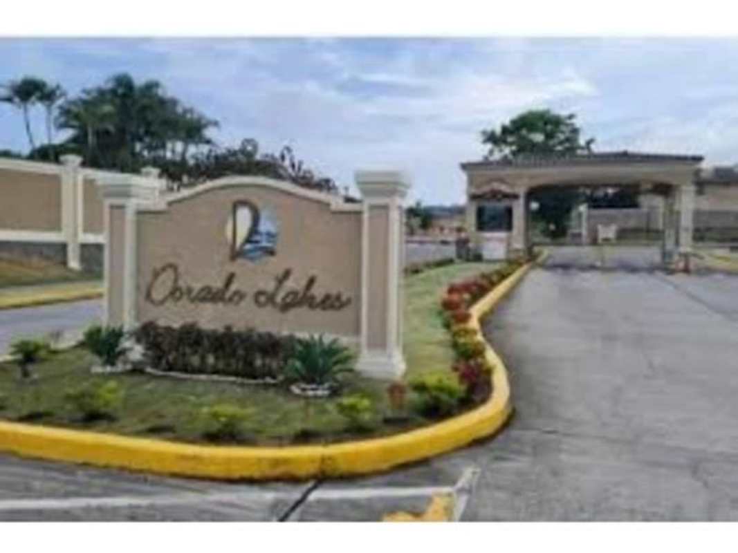 Gated community entrance security booth landscaped sign Dorado Lakes Condado del Rey Panama