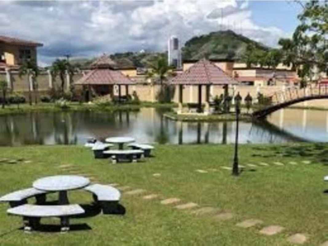Landscaped garden pond bridge gazebos picnic tables Dorado Lakes Condado del Rey Panama