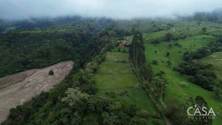 Aerial farmland view with wooded area, dirt road access on rural lot Cordillera Highlands Panama