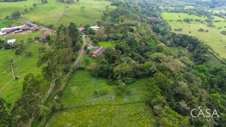 Lush green hillside farmland forest area Cordillera Highlands Panama Chiriquí aerial view
