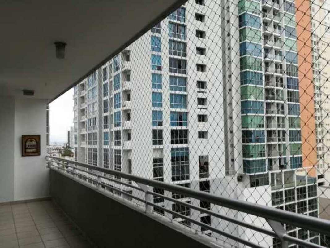 Balcony overlooking modern skyline with safety mesh PH Citrus San Francisco Panama apartment rental