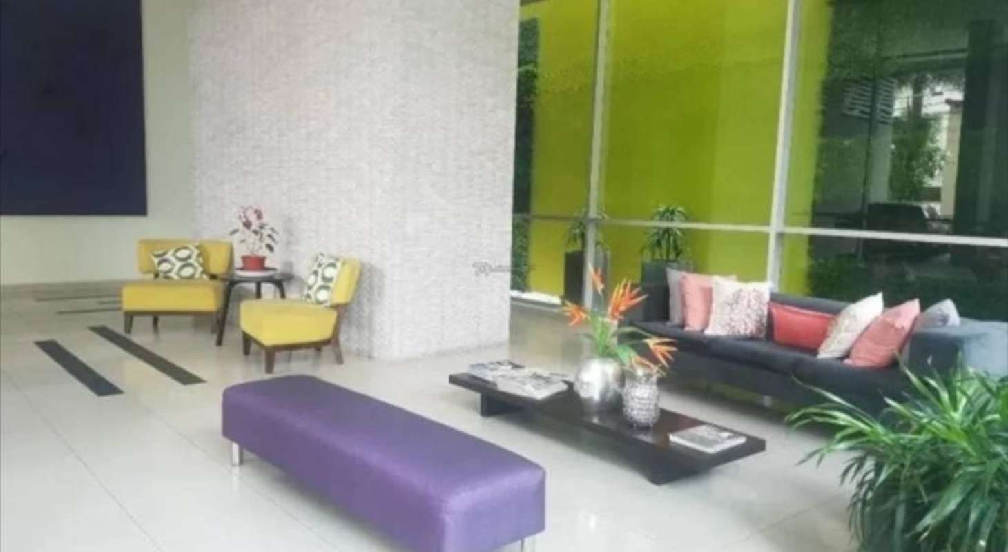 Contemporary lobby area with colorful seating large windows PH Citrus San Francisco Panama
