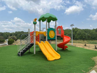 Children’s colorful play area safe family-friendly community Playa Caracol.