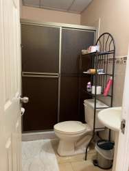 Bathroom with glass shower, beige tiles, ceramic sink Platinium Park La Chorrera