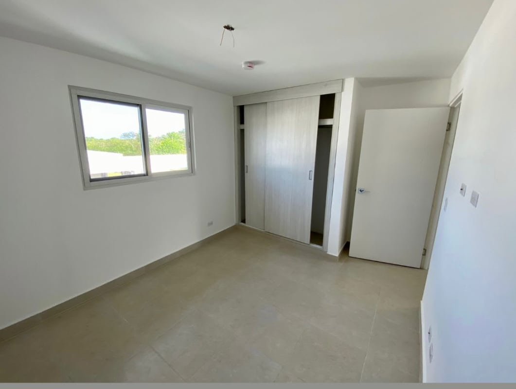 Bright empty bedroom with closet in new house Costa Sur Panama