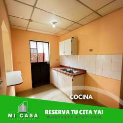 Covered front porch with columns and concrete driveway at Llano Marín Penonomé house