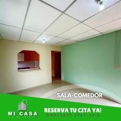 Living dining room with kitchen serving window beige tile floors in Penonomé rental house