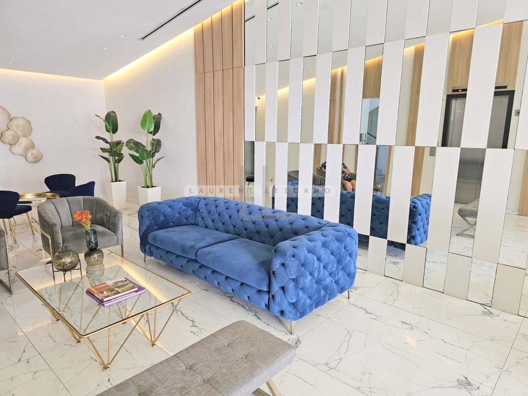 Double-height living dining area with panoramic skyline ocean views at PH Marina Terrace Panama