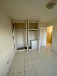 Simple modern bathroom with shower, toilet, and sink Arraiján