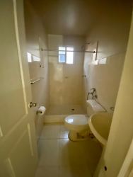 Interior hall and stairs with beige tile and white walls Los Cortijos Arraiján
