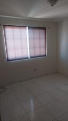 Empty secondary bedroom with large window duplex Los Cortijos Panama