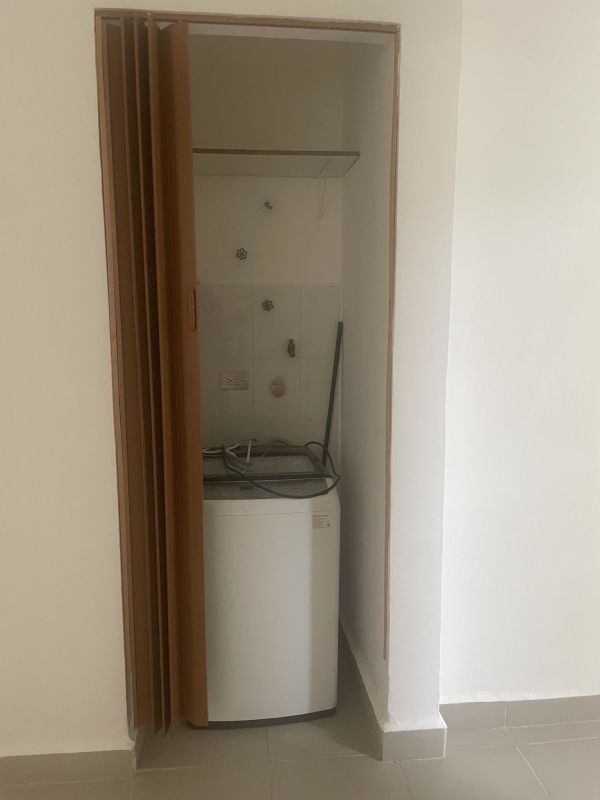 Compact laundry closet inside studio apartment PH Vistas de Ancón Panama