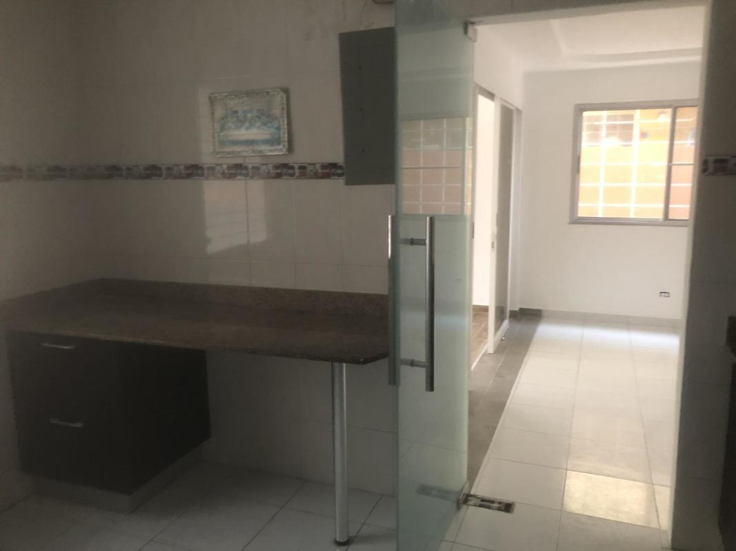 Kitchen with granite countertop and window with grille Quintas de Villa Flor Panama