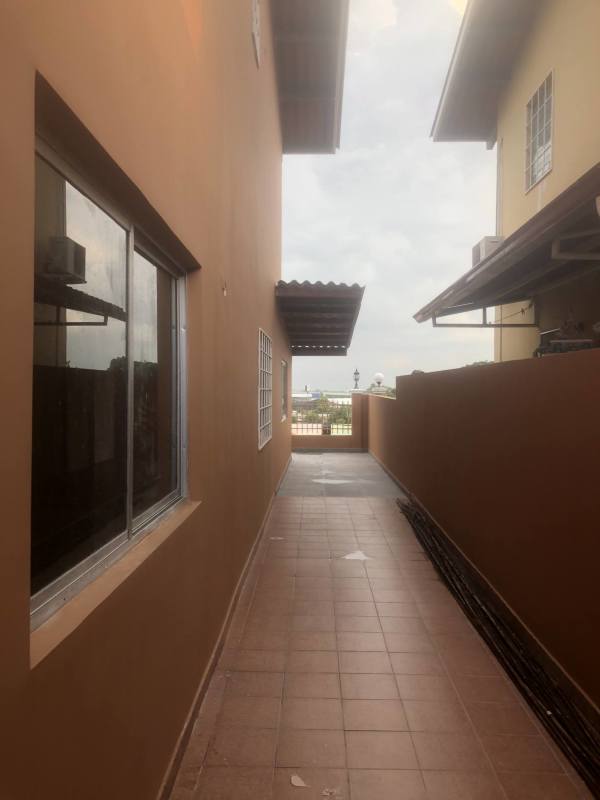 Side walkway with city skyline backdrop in Quintas de Villa Flor house Panama