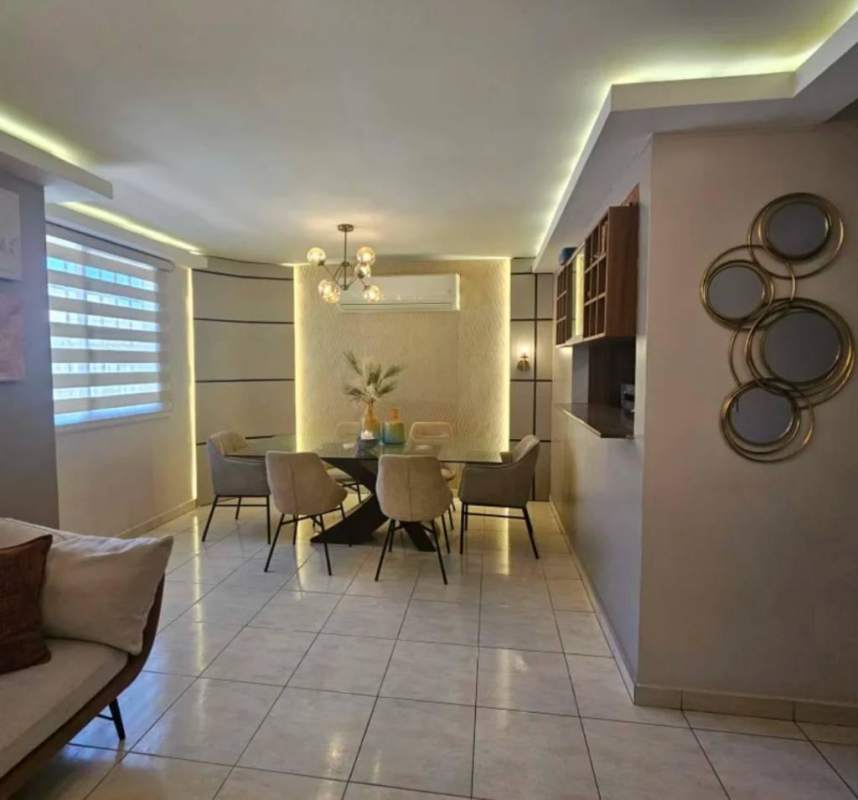 Dining area with modern LED lights and glass table Villa Lucre Panama