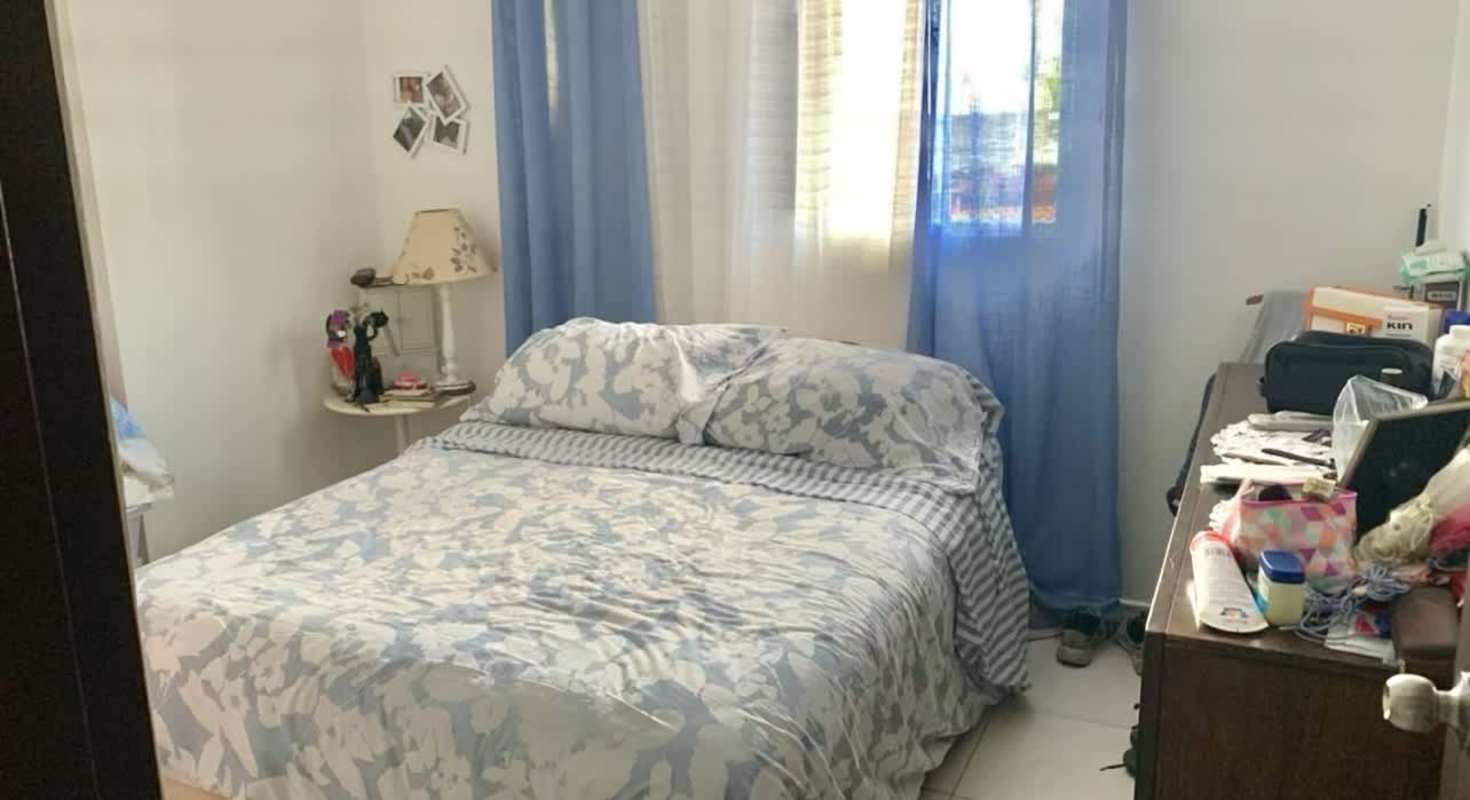 Cozy bedroom with blue curtains, closet and natural sunlight, Llano Bonito condo Panama