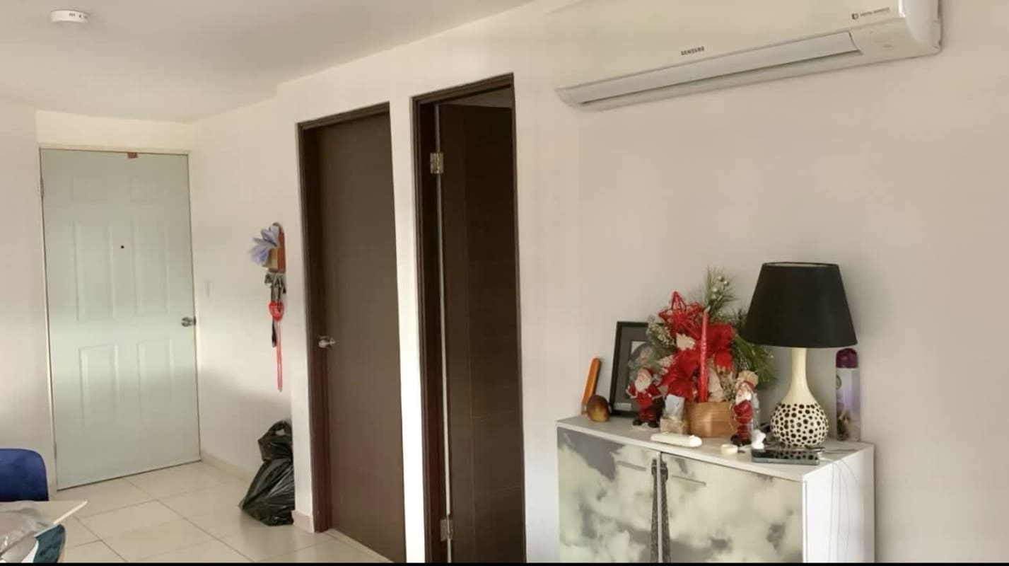 Hallway with multiple doors, split AC unit, ceramic floor in Llano Bonito apartment Panama