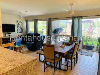 Open concept living and dining area with large terrace doors at Punta Chame Beach condo Panama