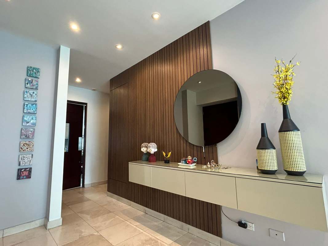 Marble dining space with glass table and panoramic window in PH Pacific Village Punta Pacifica