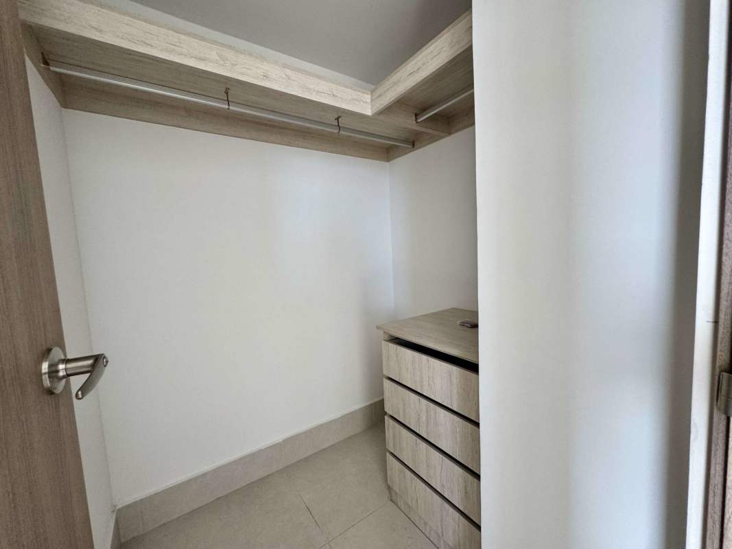 Modern bathroom with granite vanity and glass shower enclosure at PH Greenwood Villa de las Fuentes