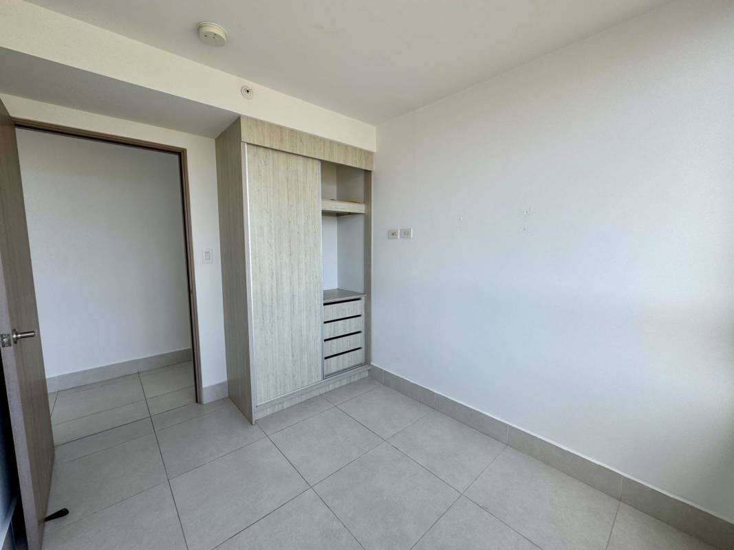 Bedroom with built-in wardrobe, tile flooring and mountain views at PH Greenwood Villa de las Fuentes