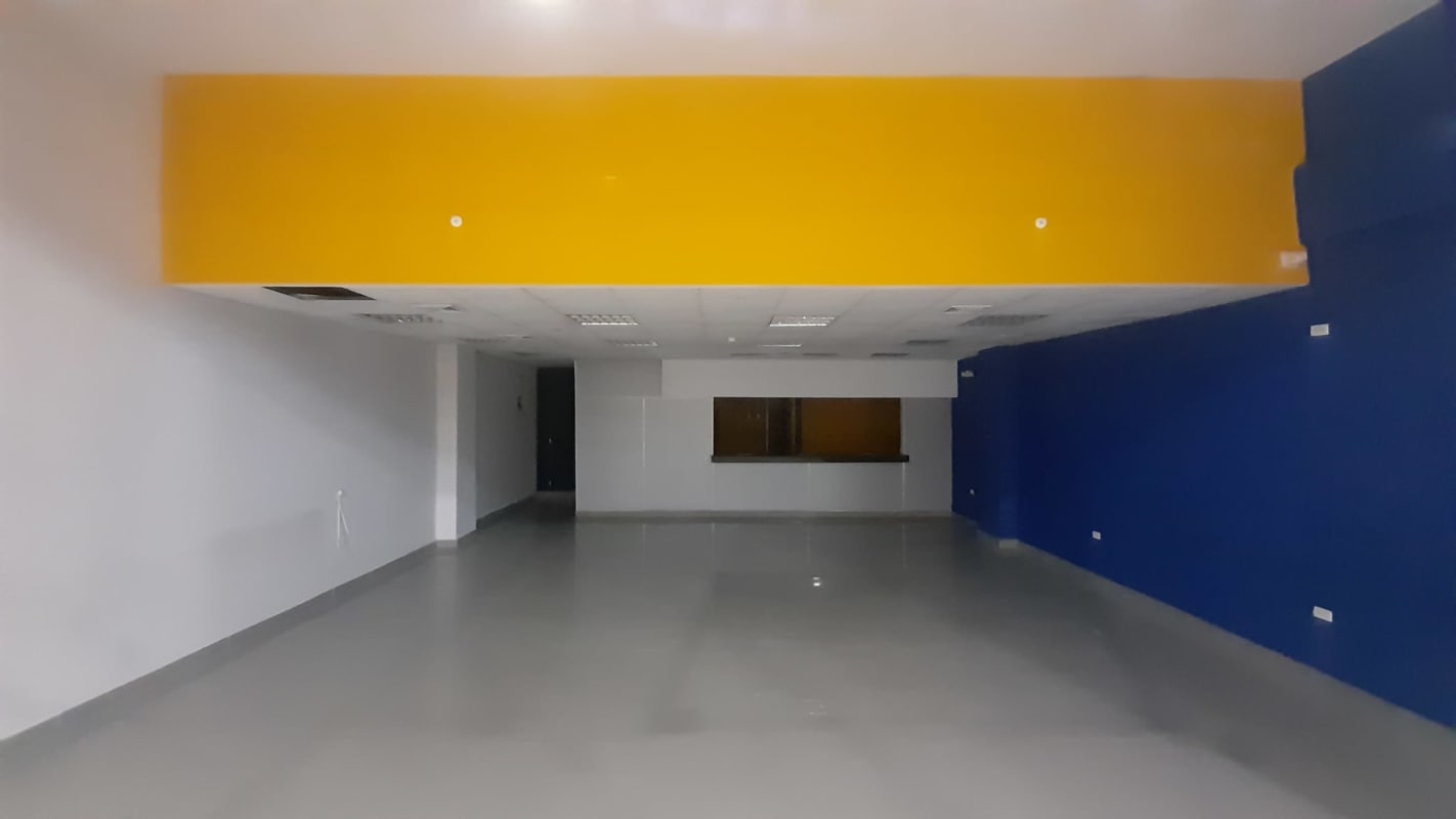 Vibrant commercial retail interior with counter and open floor inside MegaMall Panama