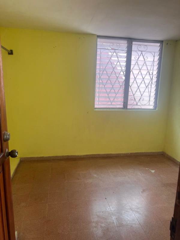 Large rear terrace with metal roof and tiled floor in Don Bosco house for sale Panama